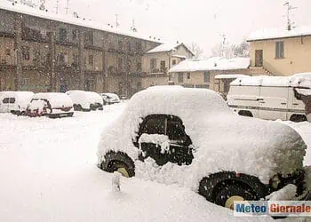 MILAN, ITALY - MARCH 22: Park cars covered with snow during an heavy snowfall in Milan March 22, 2006